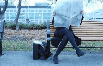 Woman Reading a Newspaper